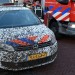 Politieauto onder de modder bij spoedmelding voor brand aan de Vrijenburglaan in Barendrecht
